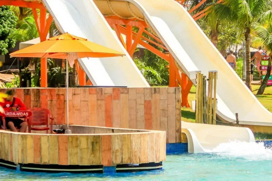 In-ground swimming pool slides in an exotic resort