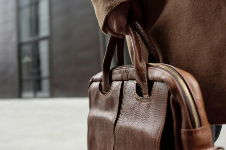Photo of a Person's Hand Holding a Handbag